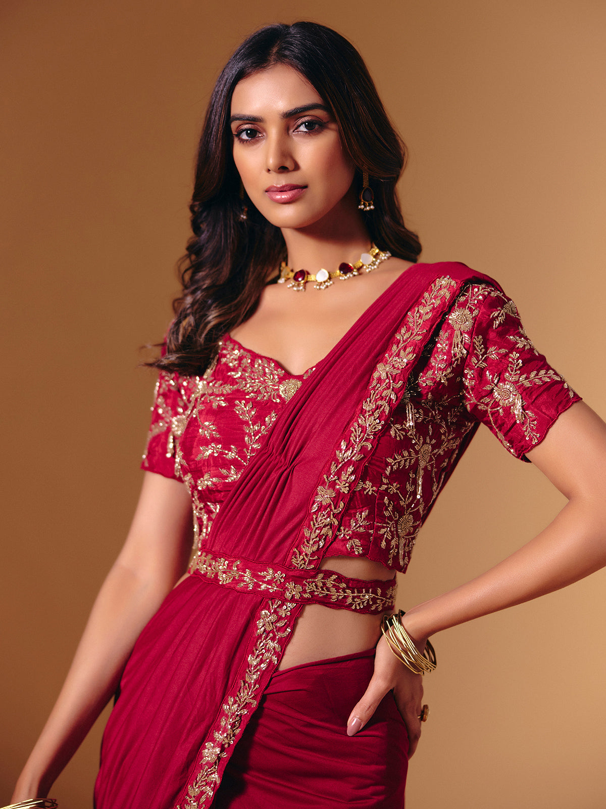 Red satin lycra saree with dazzling cutdana accents
