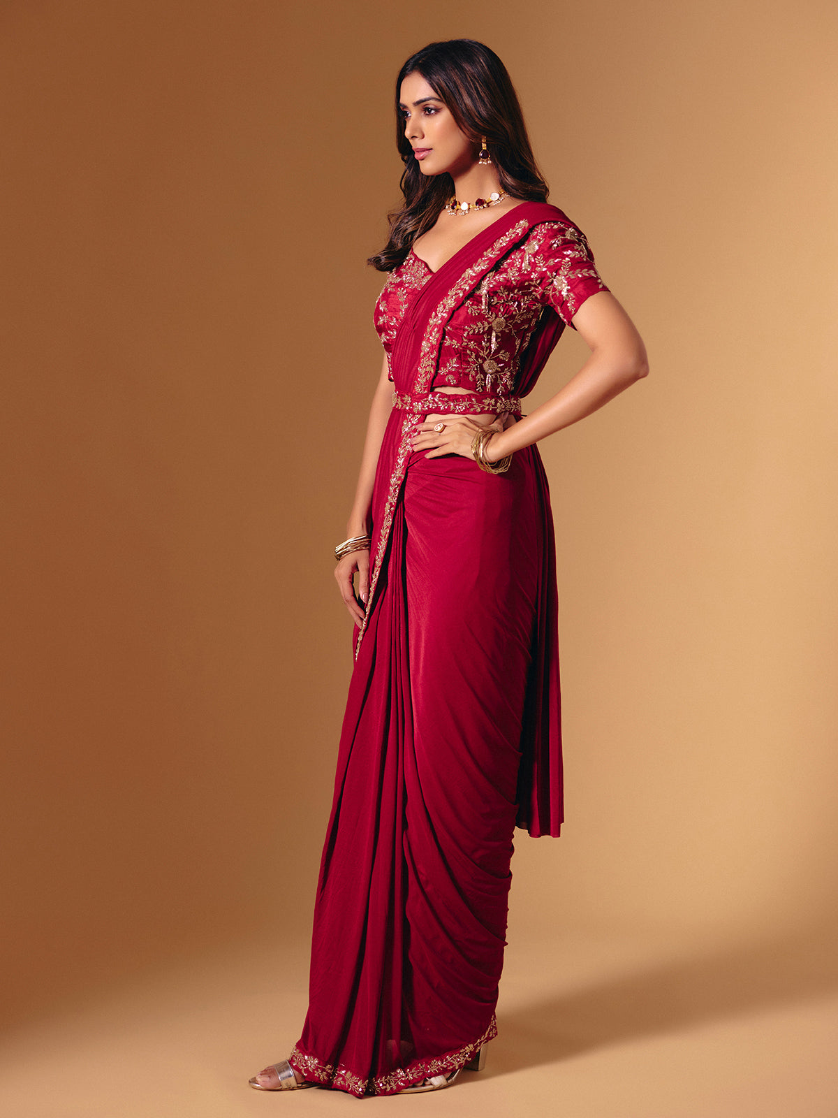 Red satin lycra saree with dazzling cutdana accents