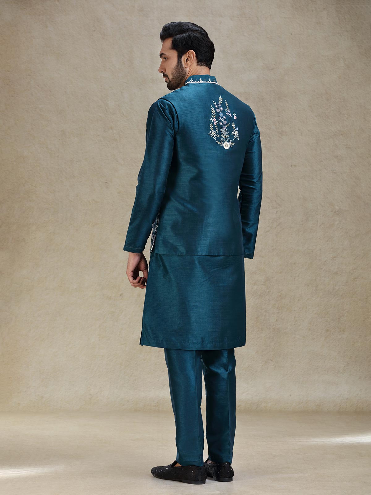 Teal blue beautifully embroidered silk kurta jacket set