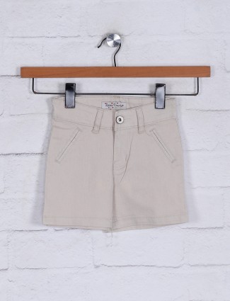 Beige solid shorts for girls