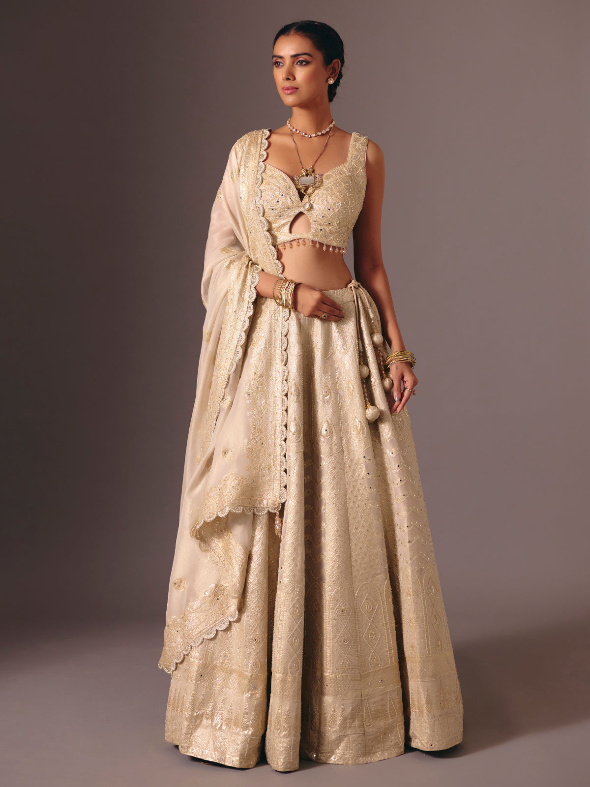 Gold banarasi tissue silk lehenga choli with mirror detailing