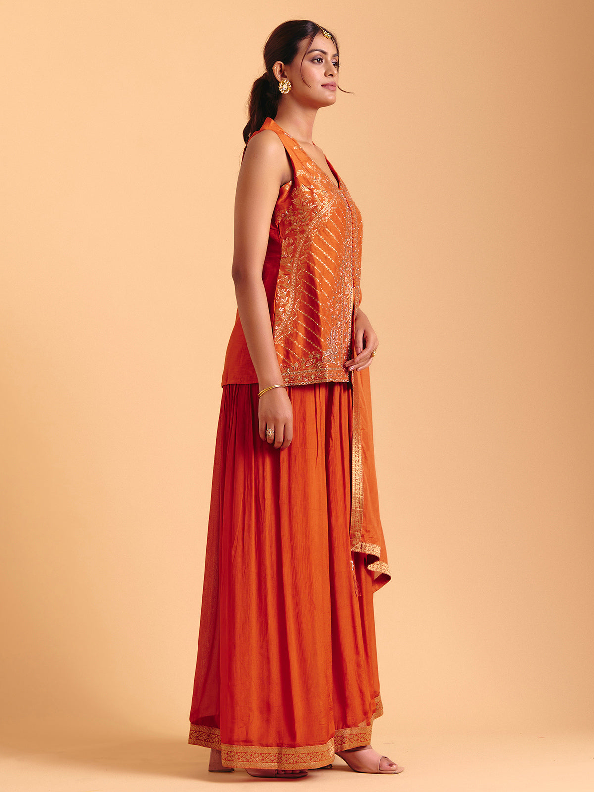 Orange tissue silk palazzo suit with zari glow