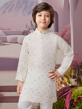 White silk kurta set with subtle glow