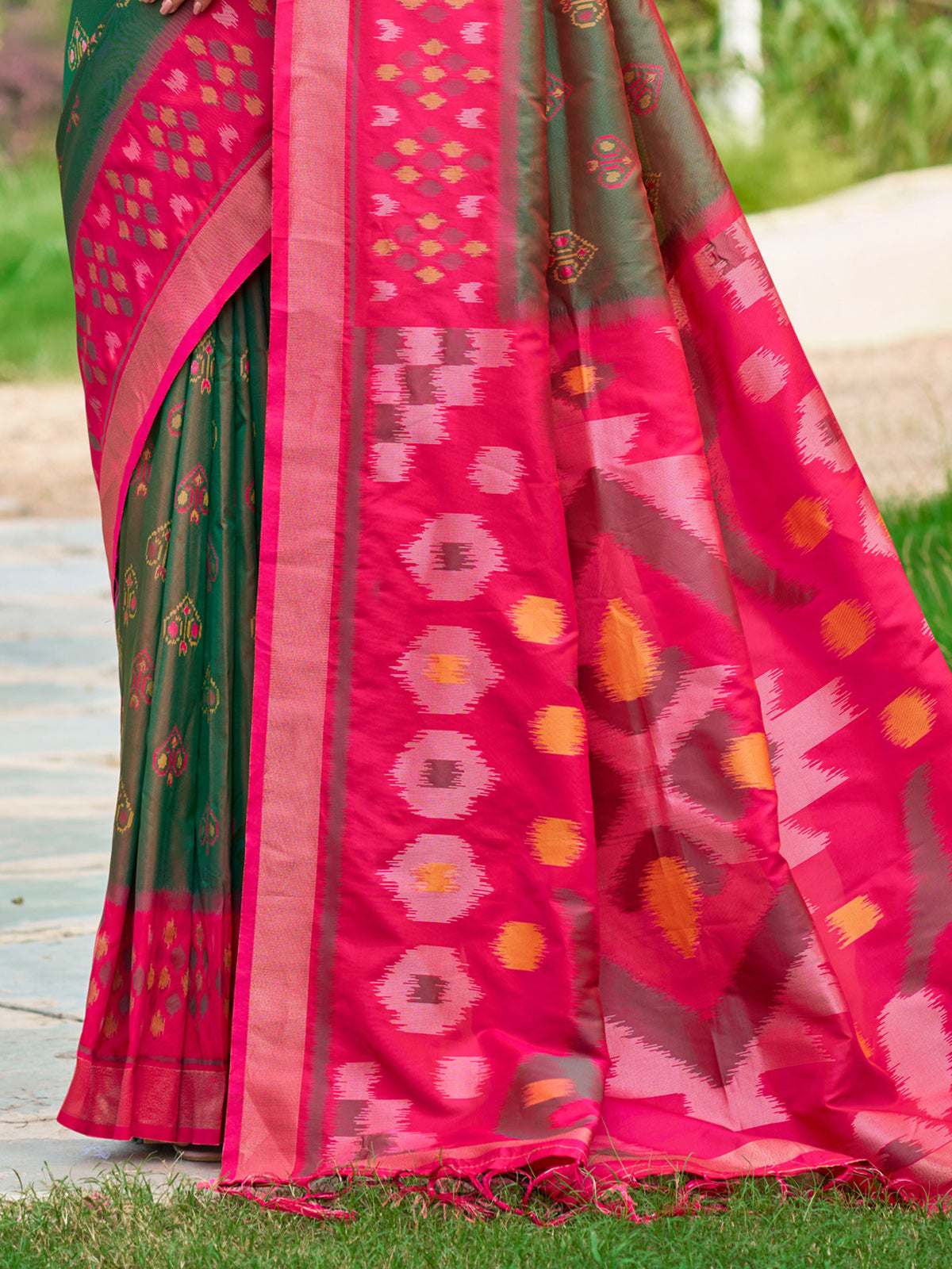 Green printed silk saree with contrast border and pallu