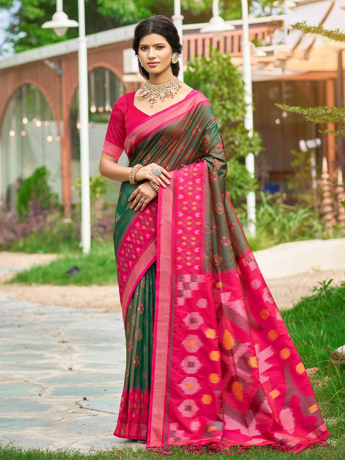 Green printed silk saree with contrast border and pallu