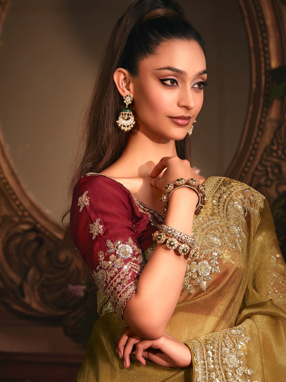 Mehendi green tissue organza saree with striking marron blouse