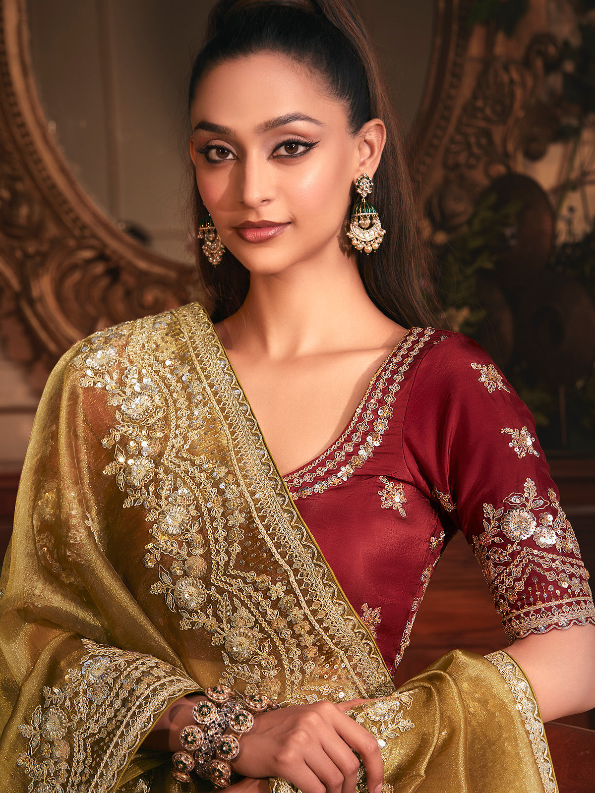 Mehendi green tissue organza saree with striking marron blouse