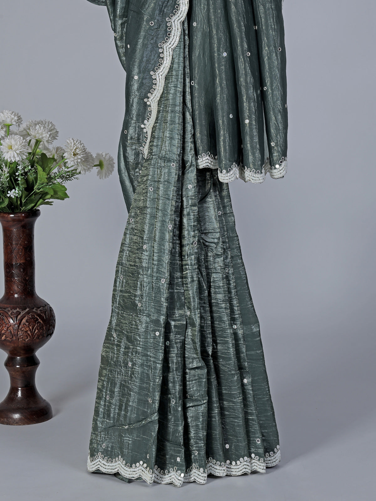 Rama green tissue silk saree with elegant embellishments