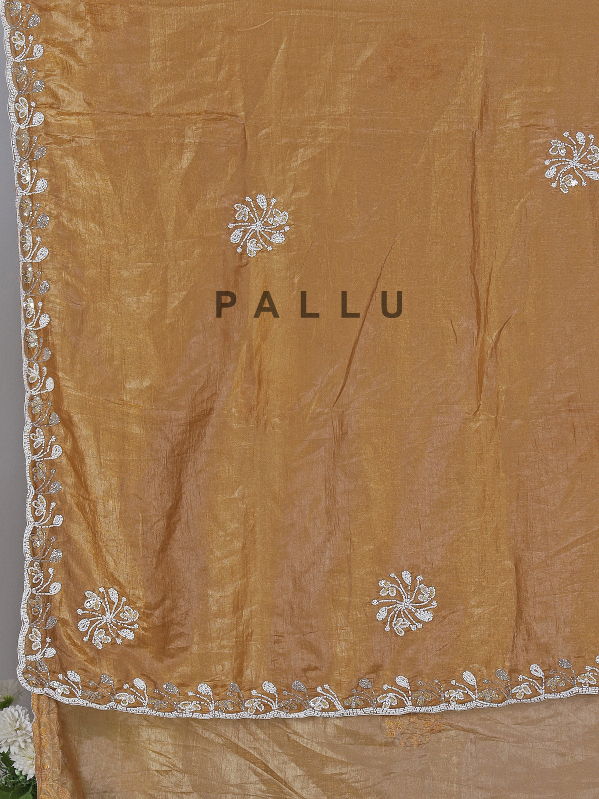 Dark beige cruss tissue silk saree with bead embellishments