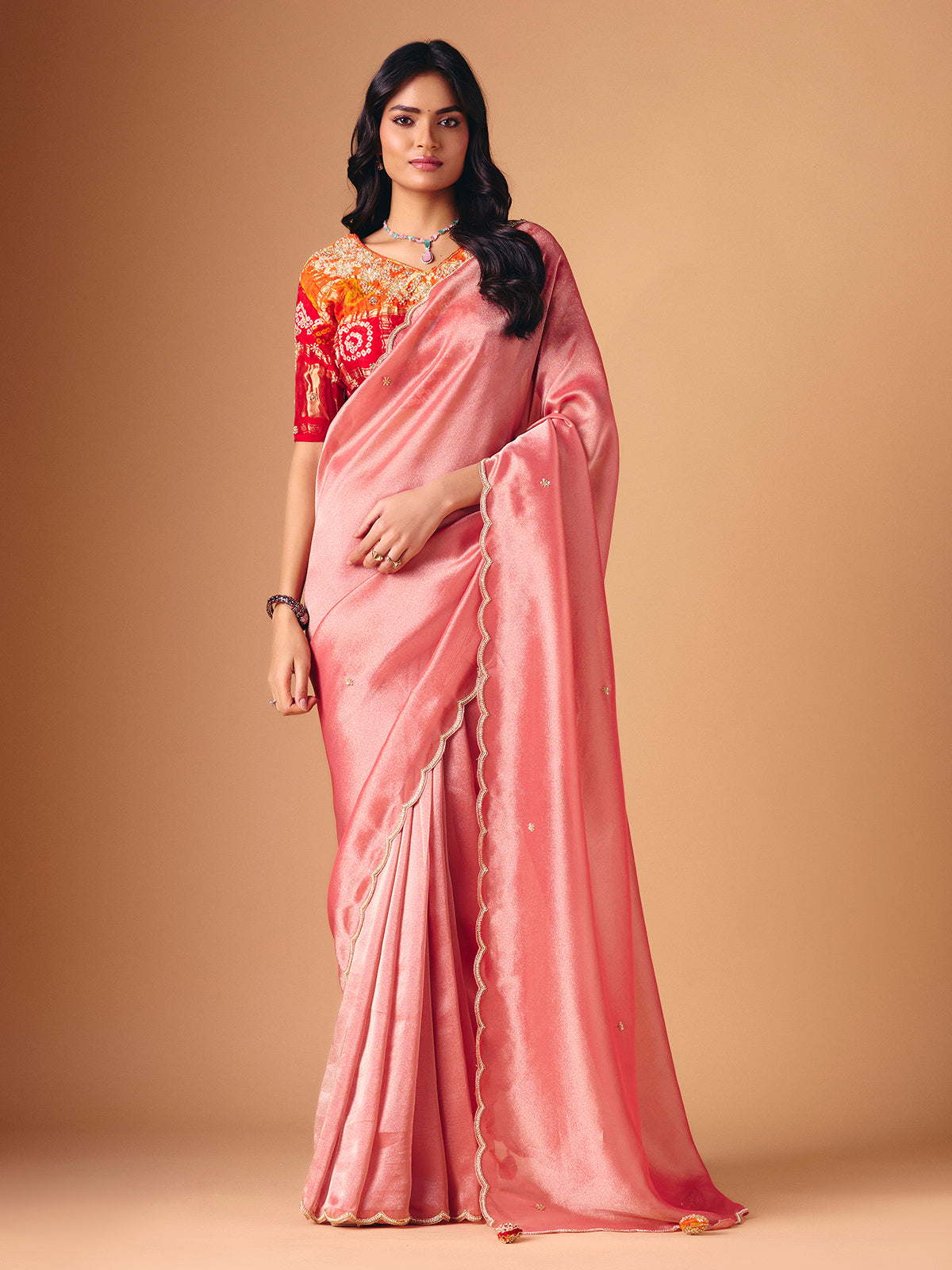 Peach tissue silk embellished saree