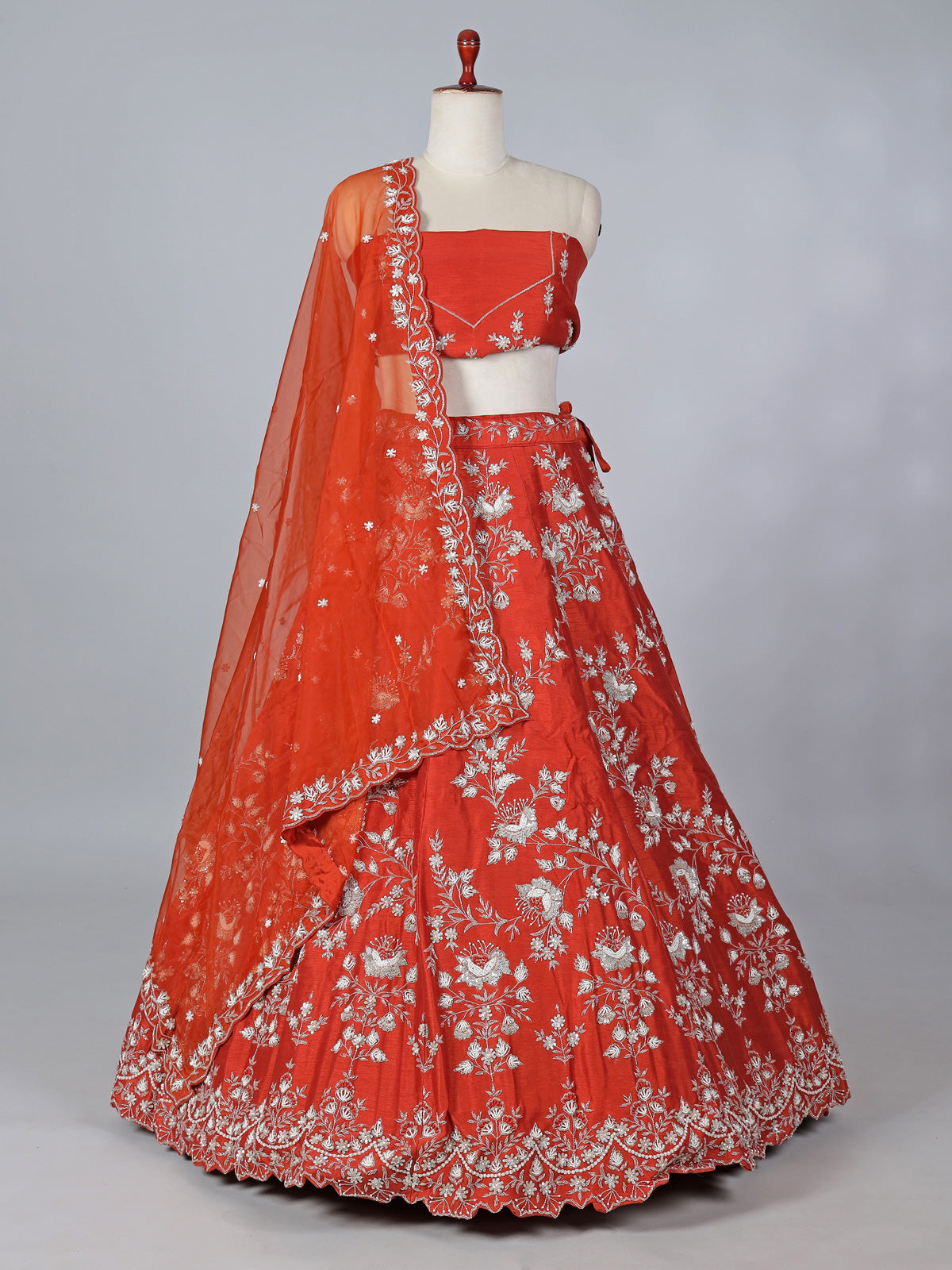 Rust orange raw silk embellished lehenga choli
