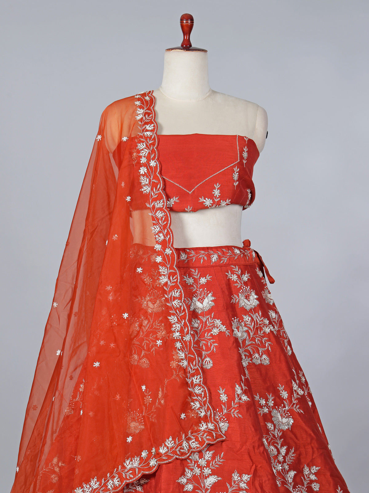 Rust orange raw silk embellished lehenga choli