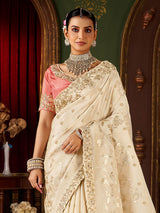 Cream soft silk embroidered saree with contrast blouse