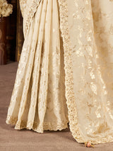 Cream soft silk embroidered saree with contrast blouse