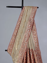 Cream shimmer tissue silk saree with festive border