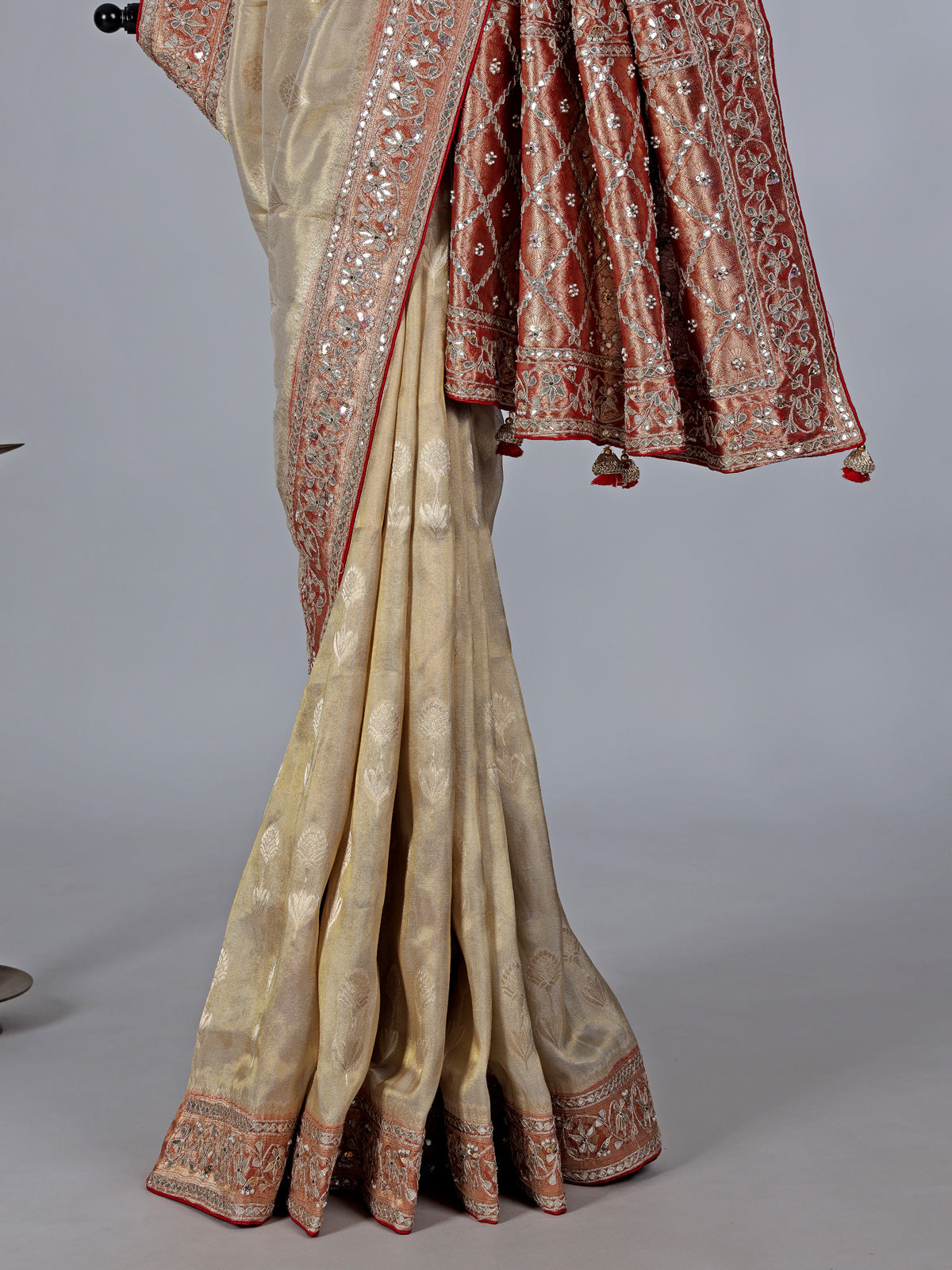 Cream shimmer tissue silk saree with festive border