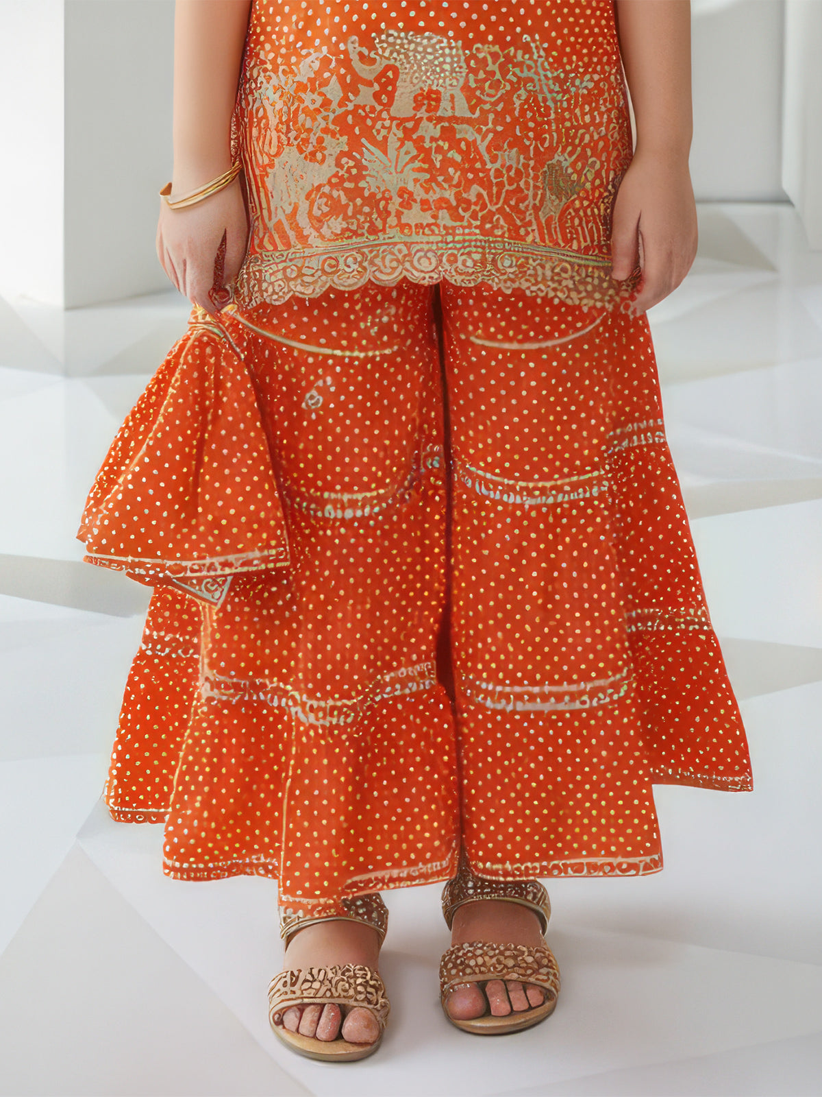 Orange silk printed sharara suit with dupatta