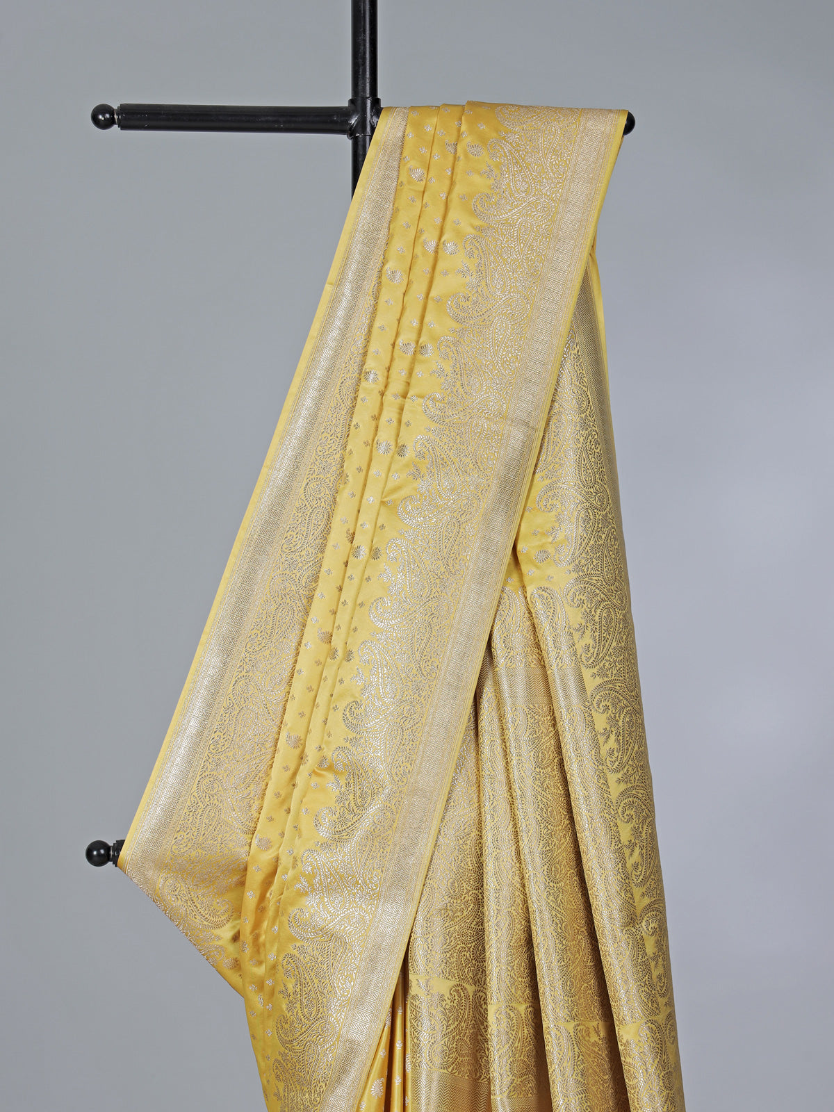 Yellow semi silk saree with festive zari detailing