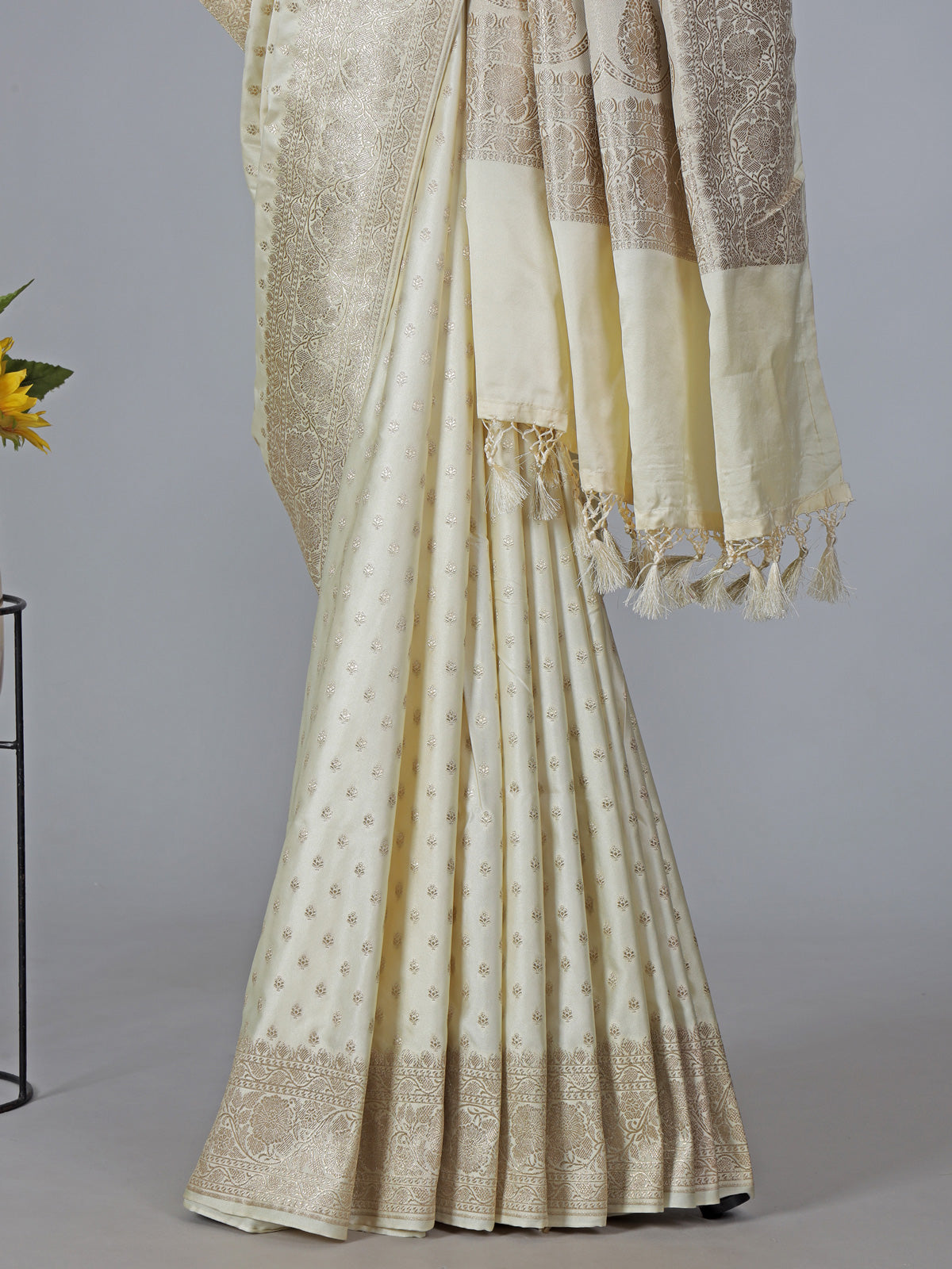 Cream art silk zari embellished traditional wear saree