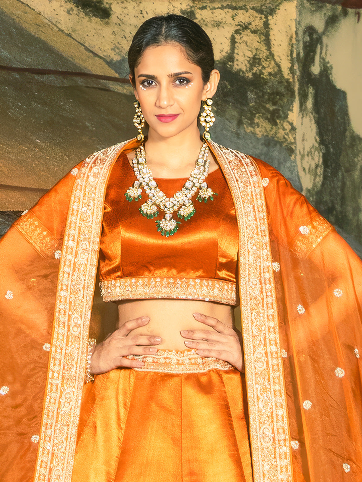 Orange raw silk lehenga choli with embellished dupatta