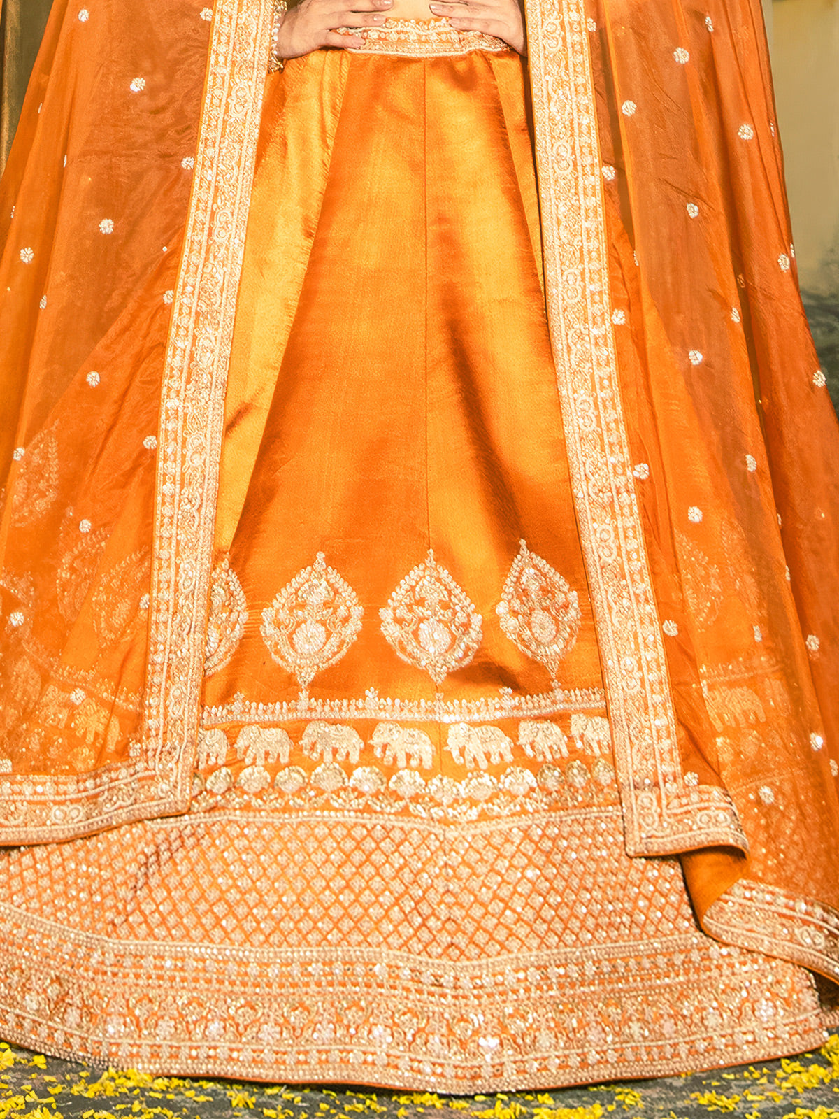 Orange raw silk lehenga choli with embellished dupatta