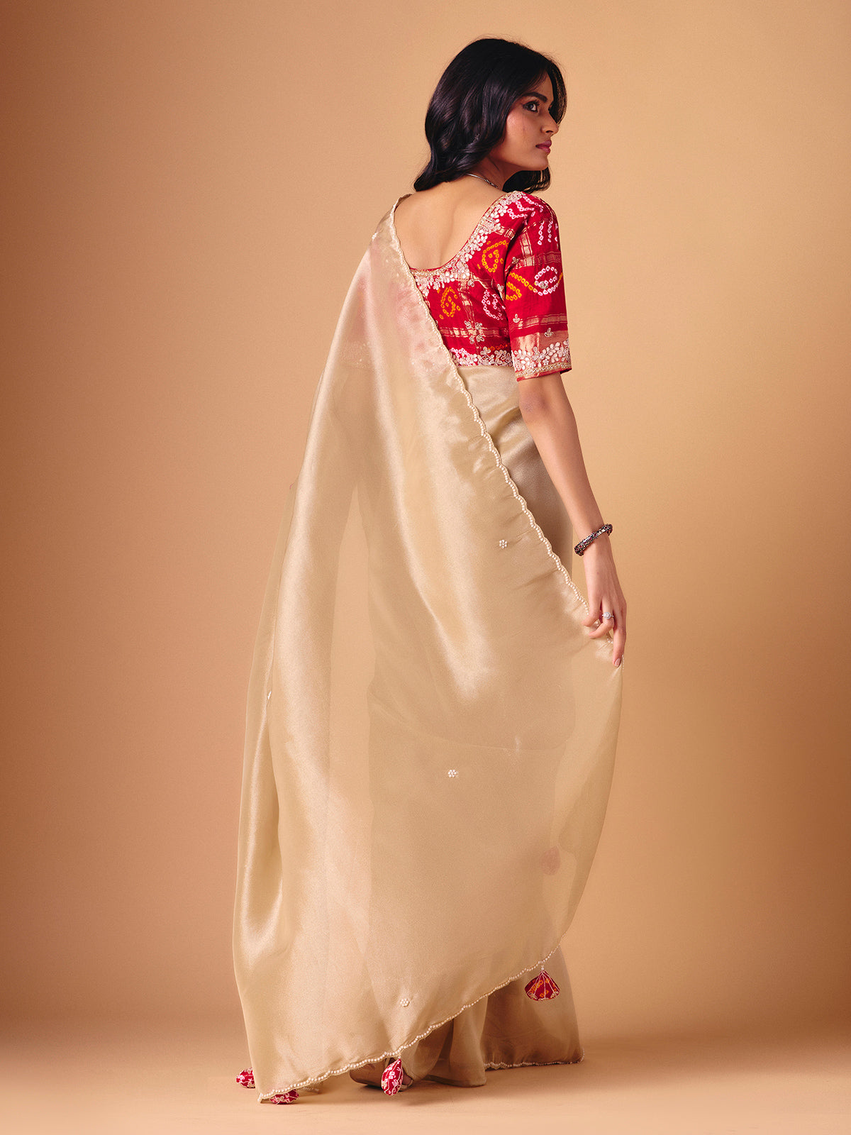Beige tissue silk reception wear saree