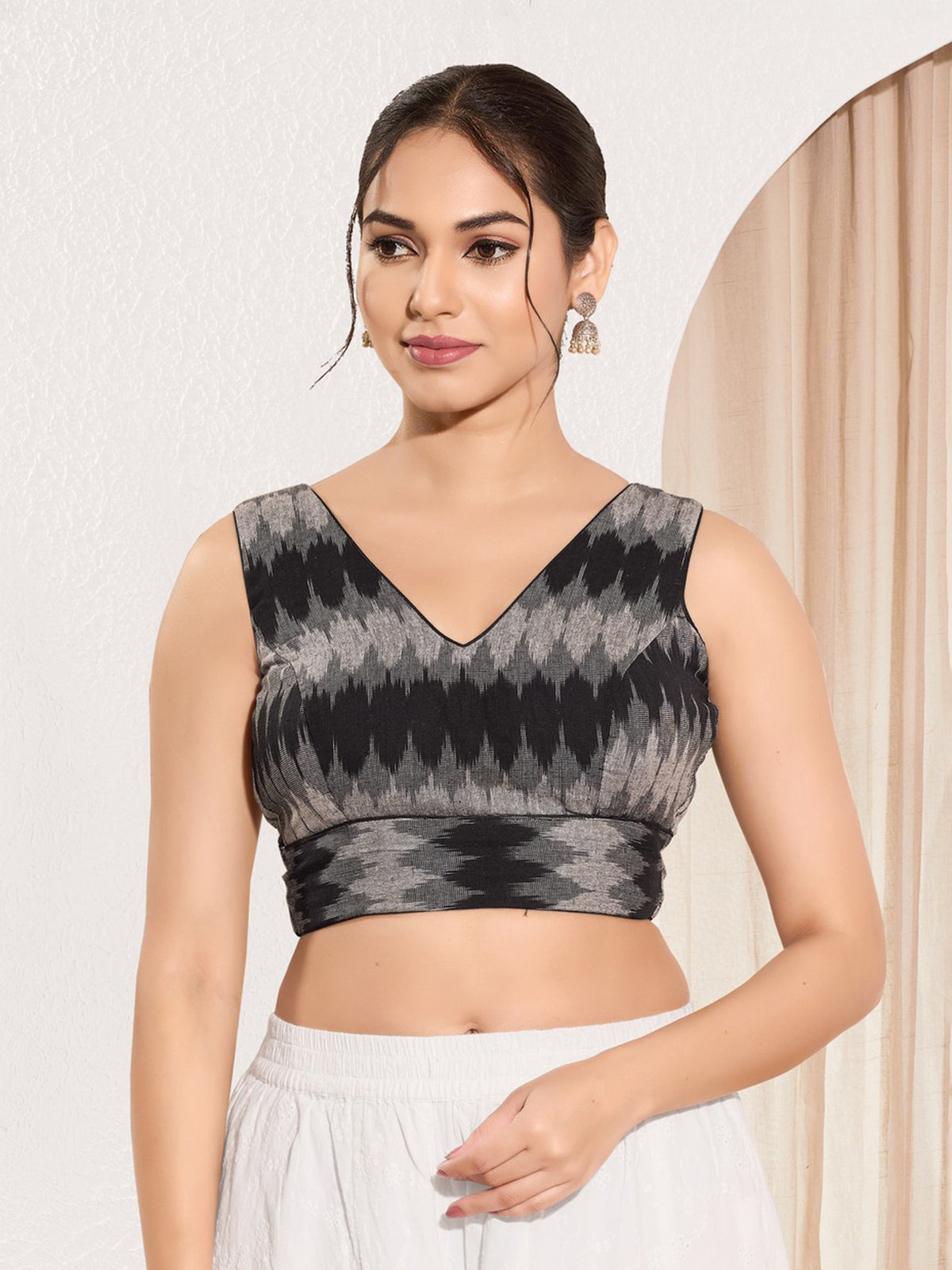 Black printed ikat silk sleeveless blouse