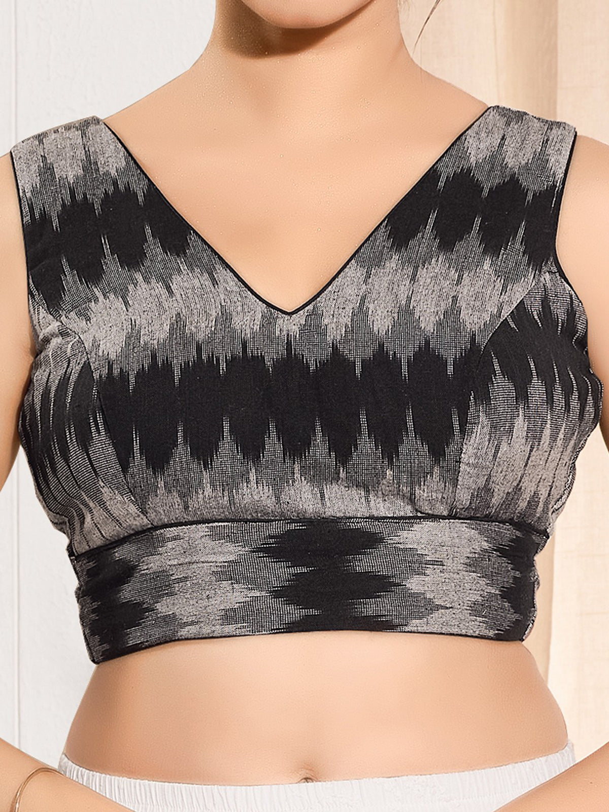 Black printed ikat silk sleeveless blouse