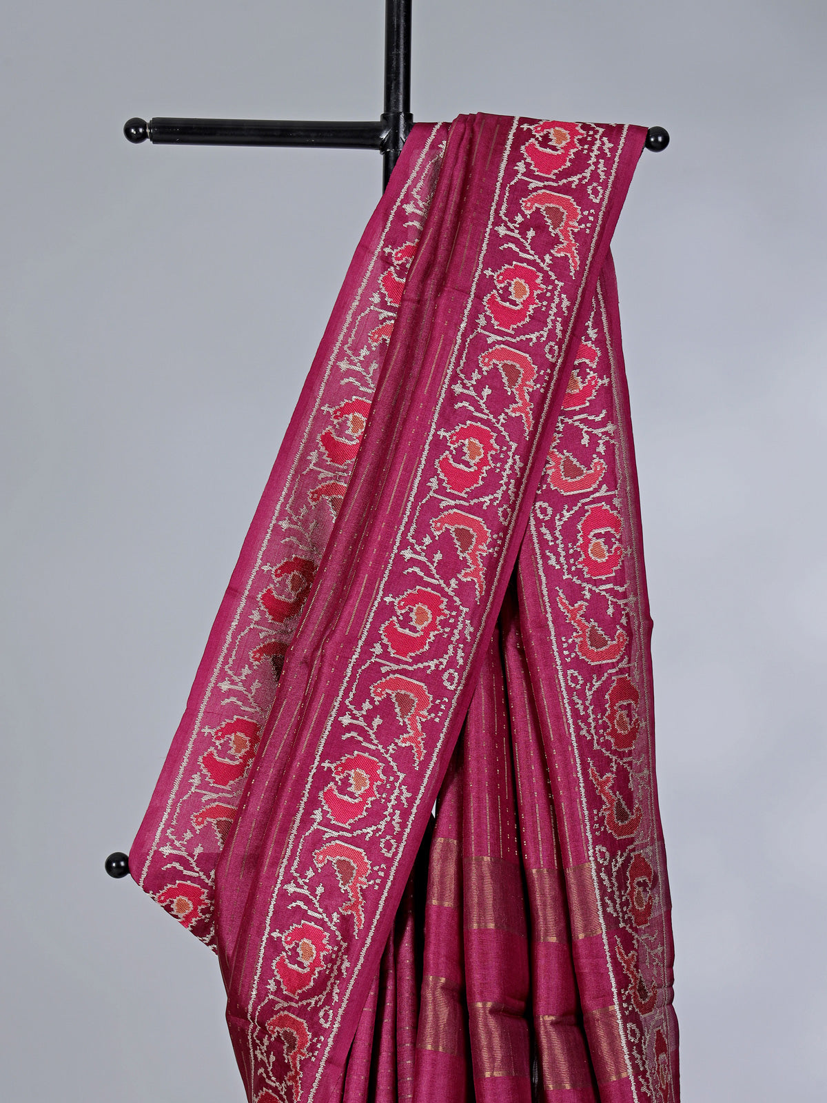 Maroon art tusser silk patola print border saree