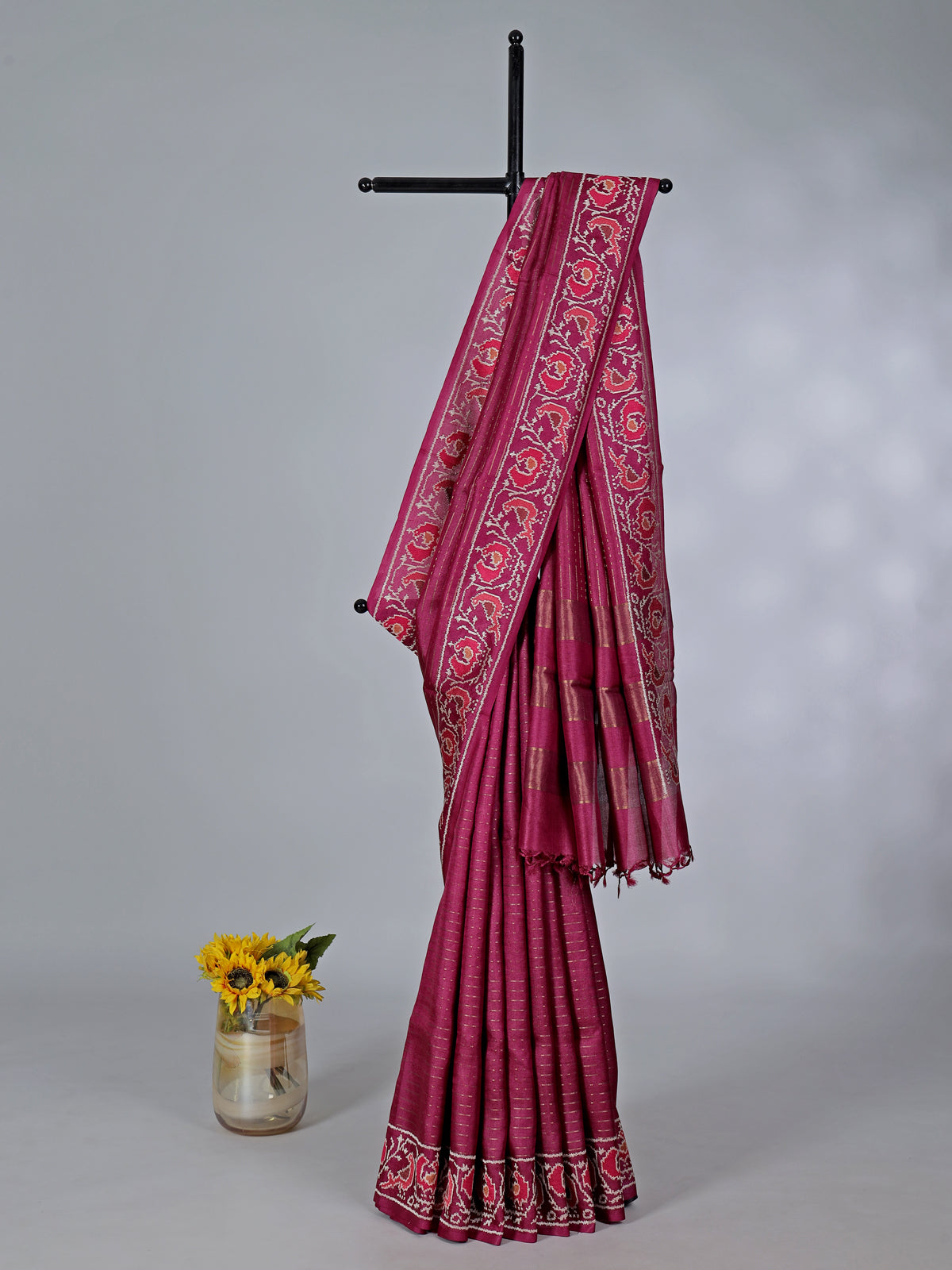 Maroon art tusser silk patola print border saree