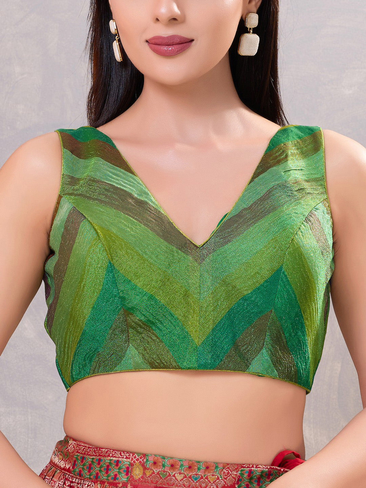 Green multi printed silk sleeveless V neck blouse