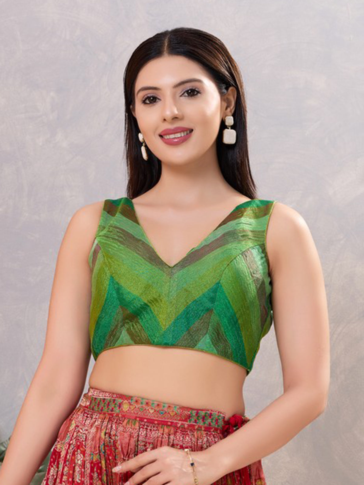 Green multi printed silk sleeveless V neck blouse