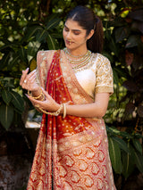 Rust Red wedding wear silk saree with rich embellishment