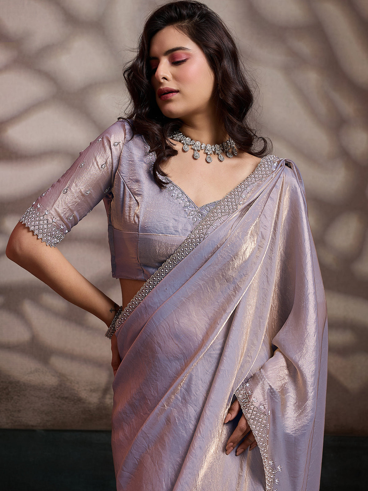 Lavendor satin silk saree with stone embellished border
