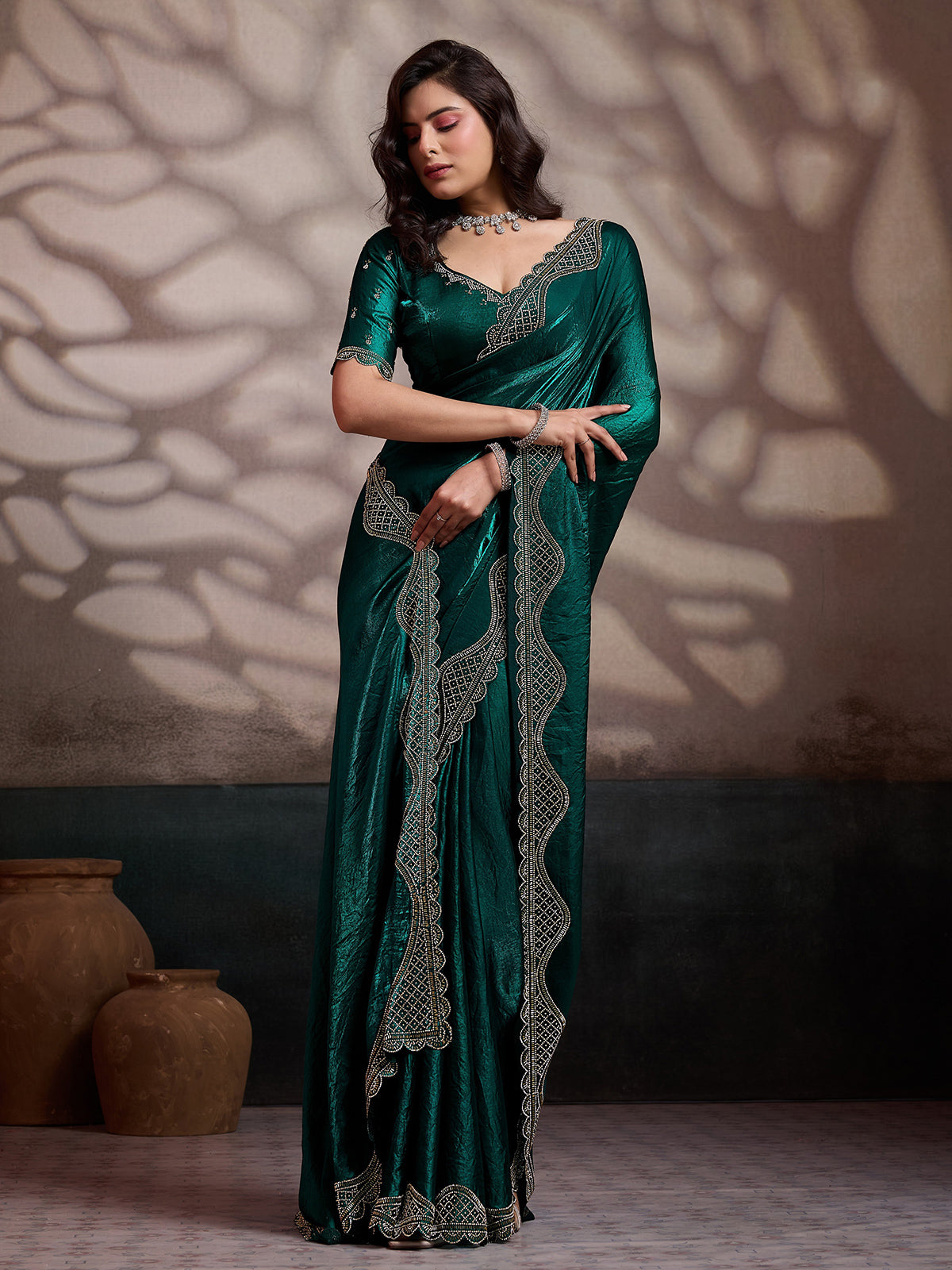 Green wedding wear satin silk saree with stone worked border