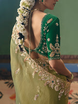 Olive green fancy silk saree accented with resham work