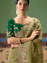 Olive green fancy silk saree accented with resham work