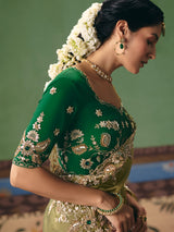 Olive green fancy silk saree accented with resham work