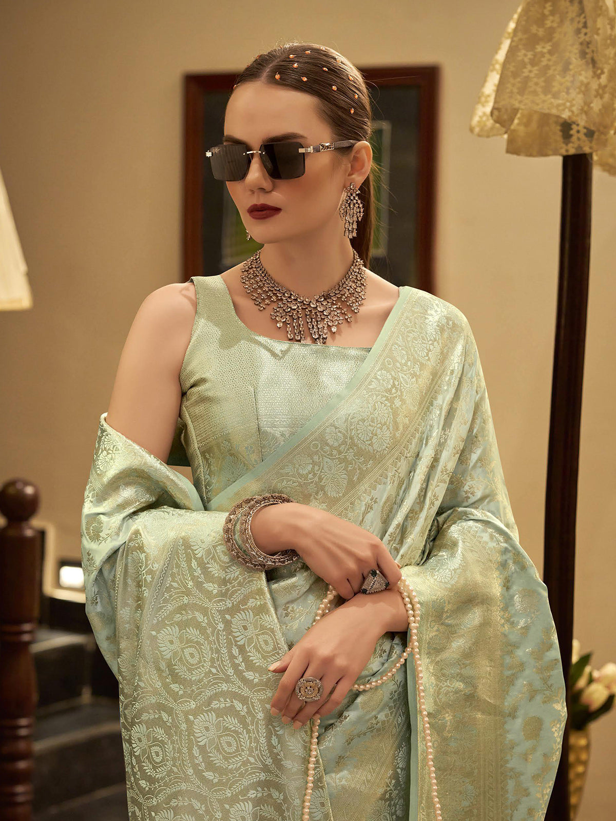 Pista green satin silk saree with zari detailing