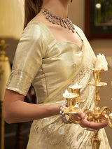 Cream satin silk saree with elegant zari work