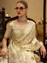 Cream satin silk saree with elegant zari work