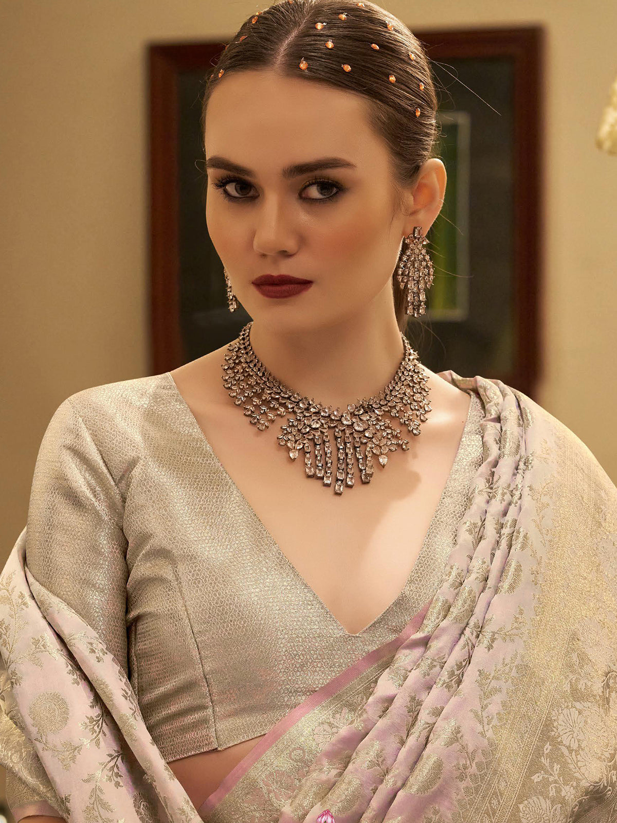 Light pink satin silk saree with zari woven motifs