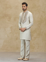 Beige linen kurta suit with colorful embroidery
