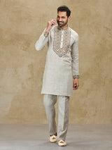 Beige linen kurta suit with colorful embroidery