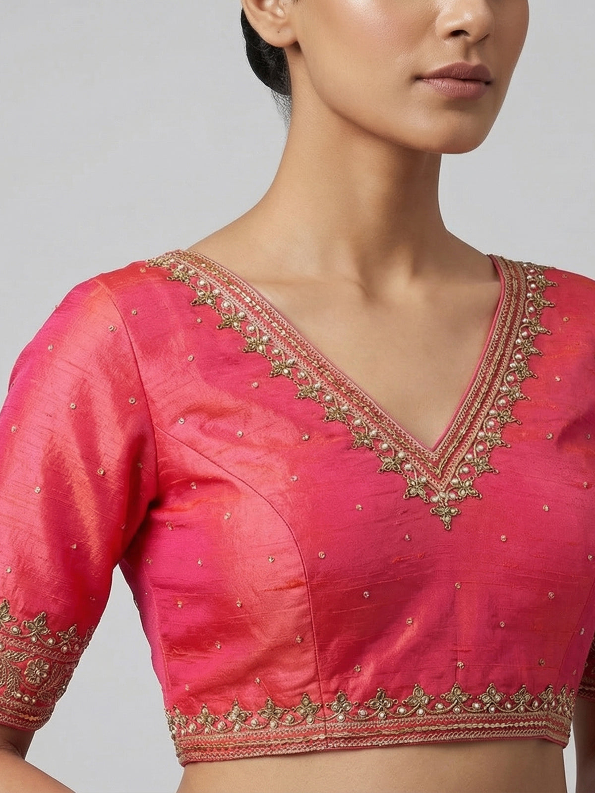 Orange raw silk zardosi embellished V neck blouse