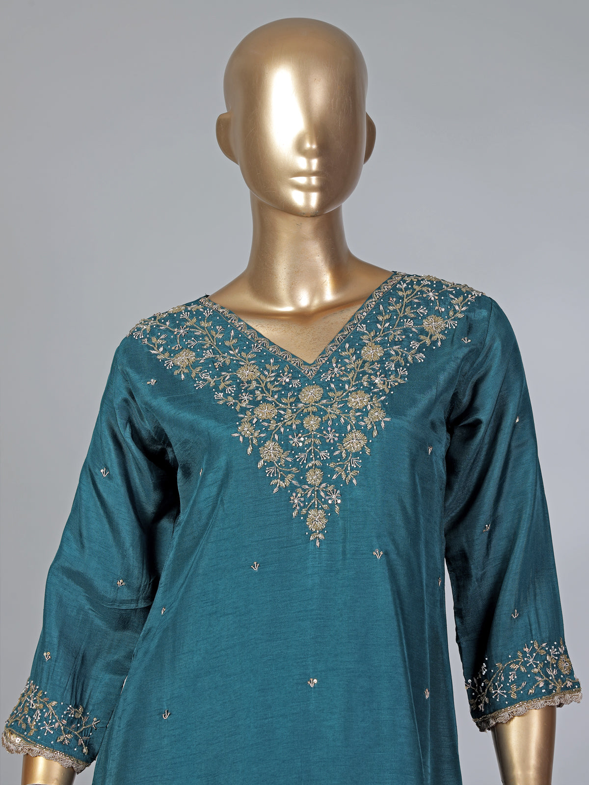 Peacock green silk zardosi embellished palazzo festive suit
