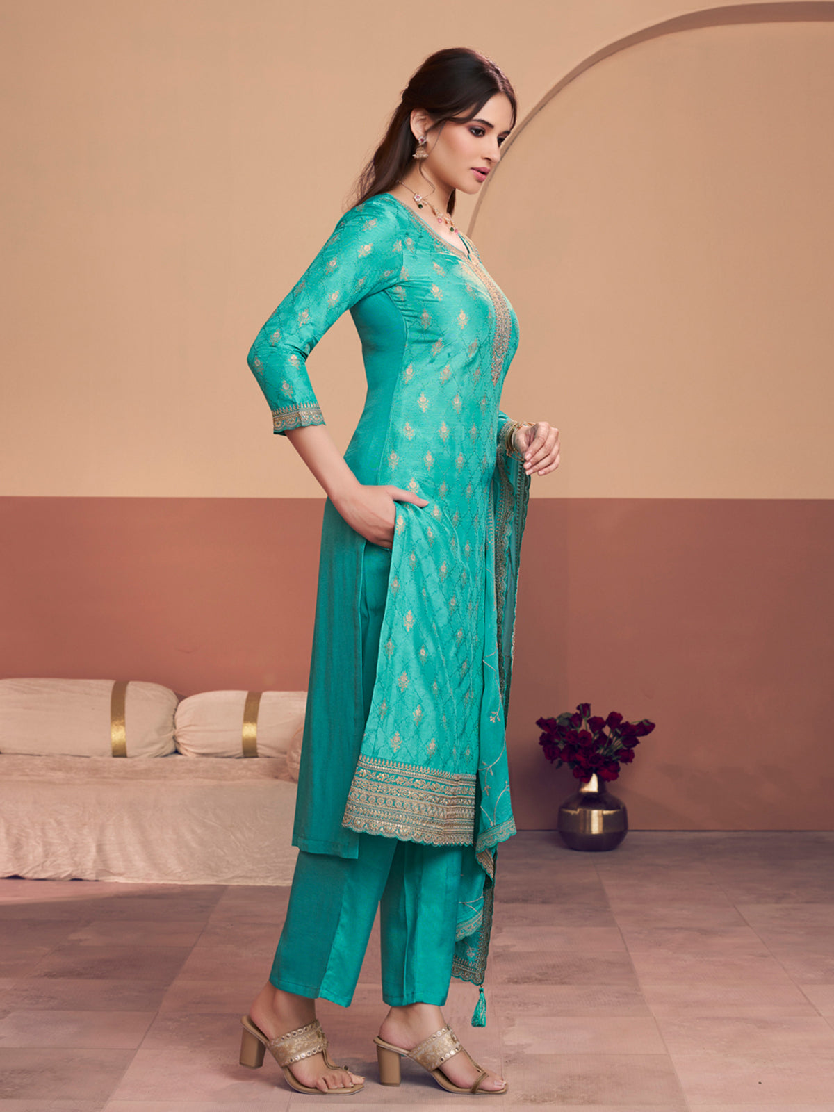 Aqua blue silk salwar suit with zari detailing