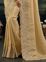 Beige kanjivaram saree with rich embellished border