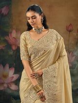 Beige kanjivaram saree with rich embellished border