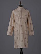 Cream silk embroidered kurta suit with festive sequin detailing